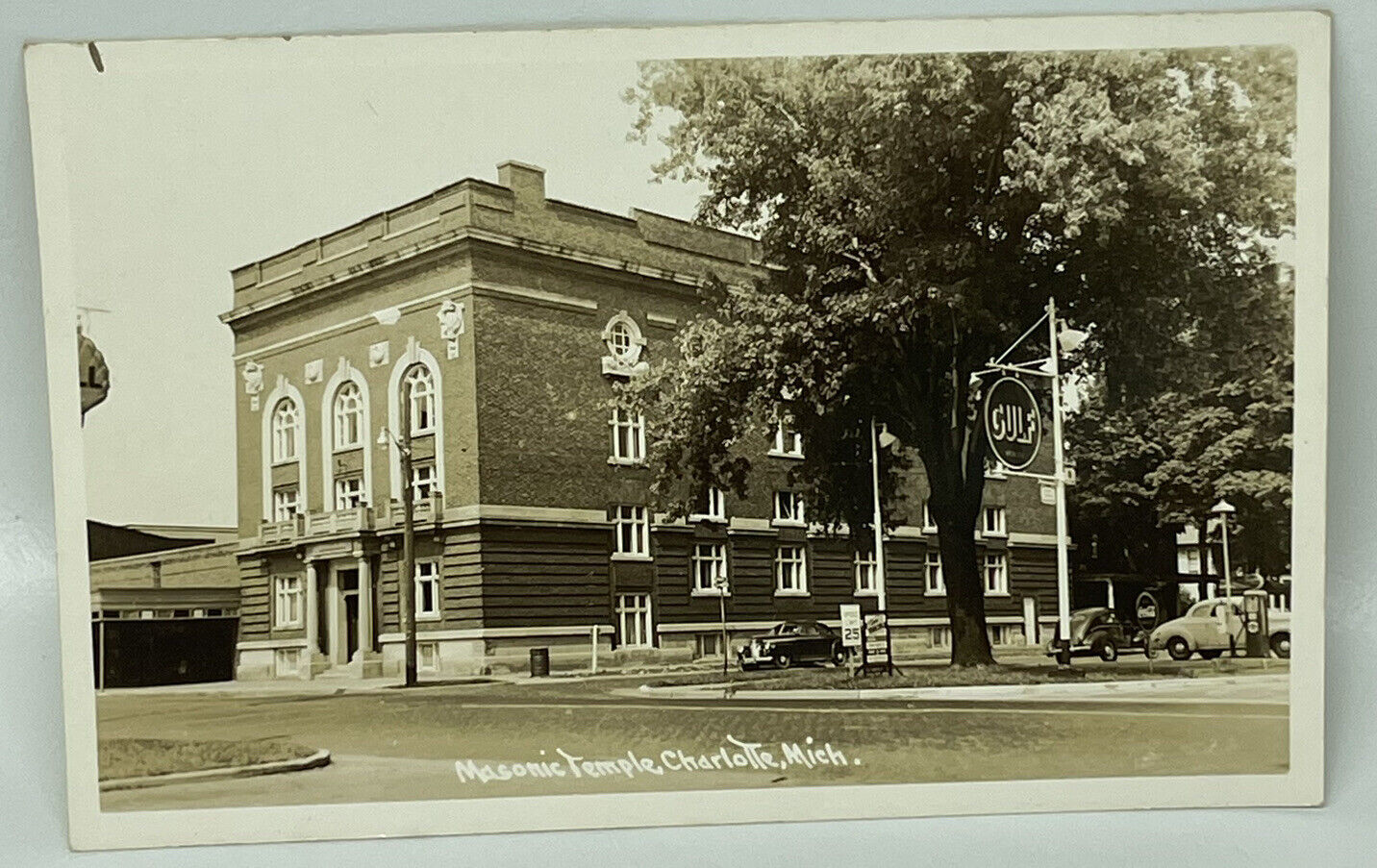 RPPC 1940s Charlotte Michigan Masonic Temple Gulf Gas Station Street Scene