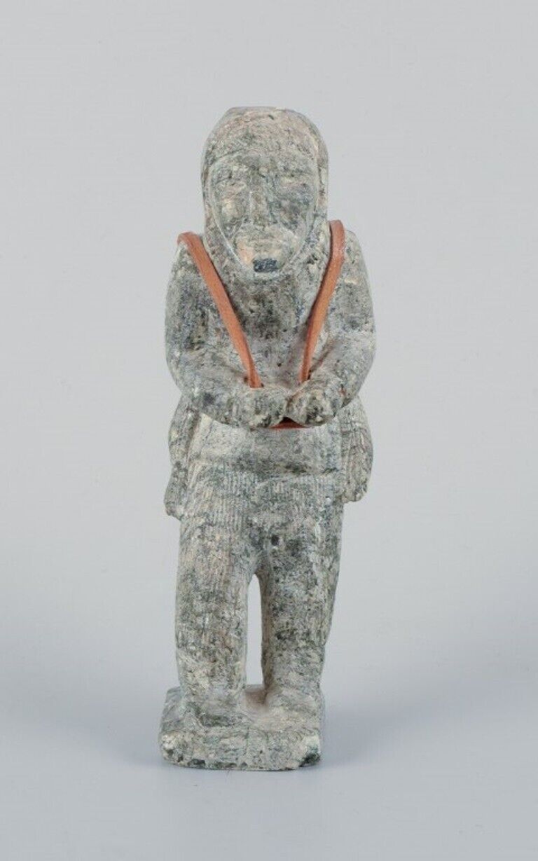 Greenlandica, old hunter with a seal on his back, sculpture in soapstone.